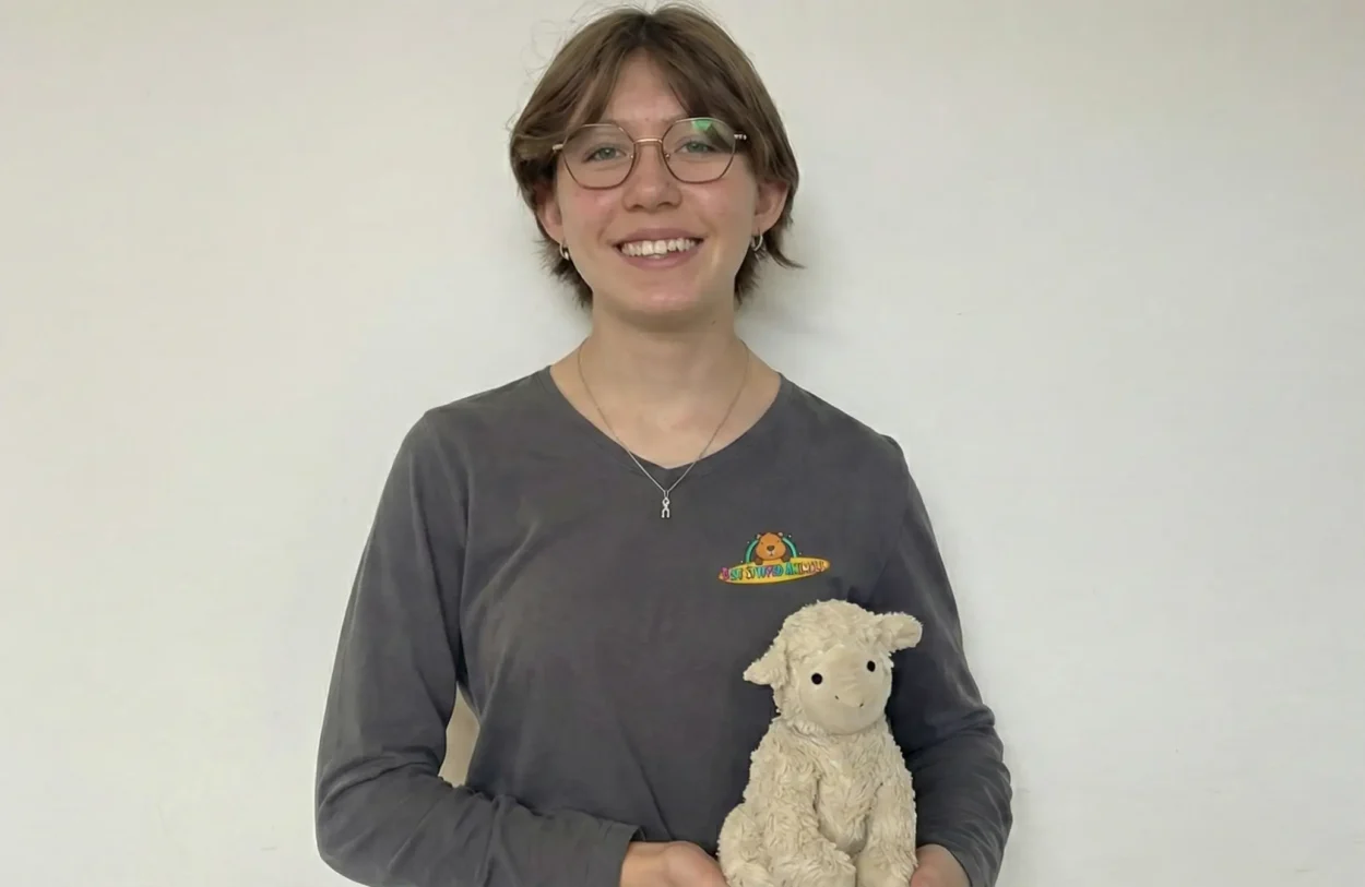 Emma hold stiffed animal plushie